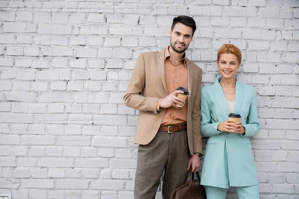 Successful Stylish Business Partners Paper Cups Smiling Camera Brick Wall — Stock Photo, Image