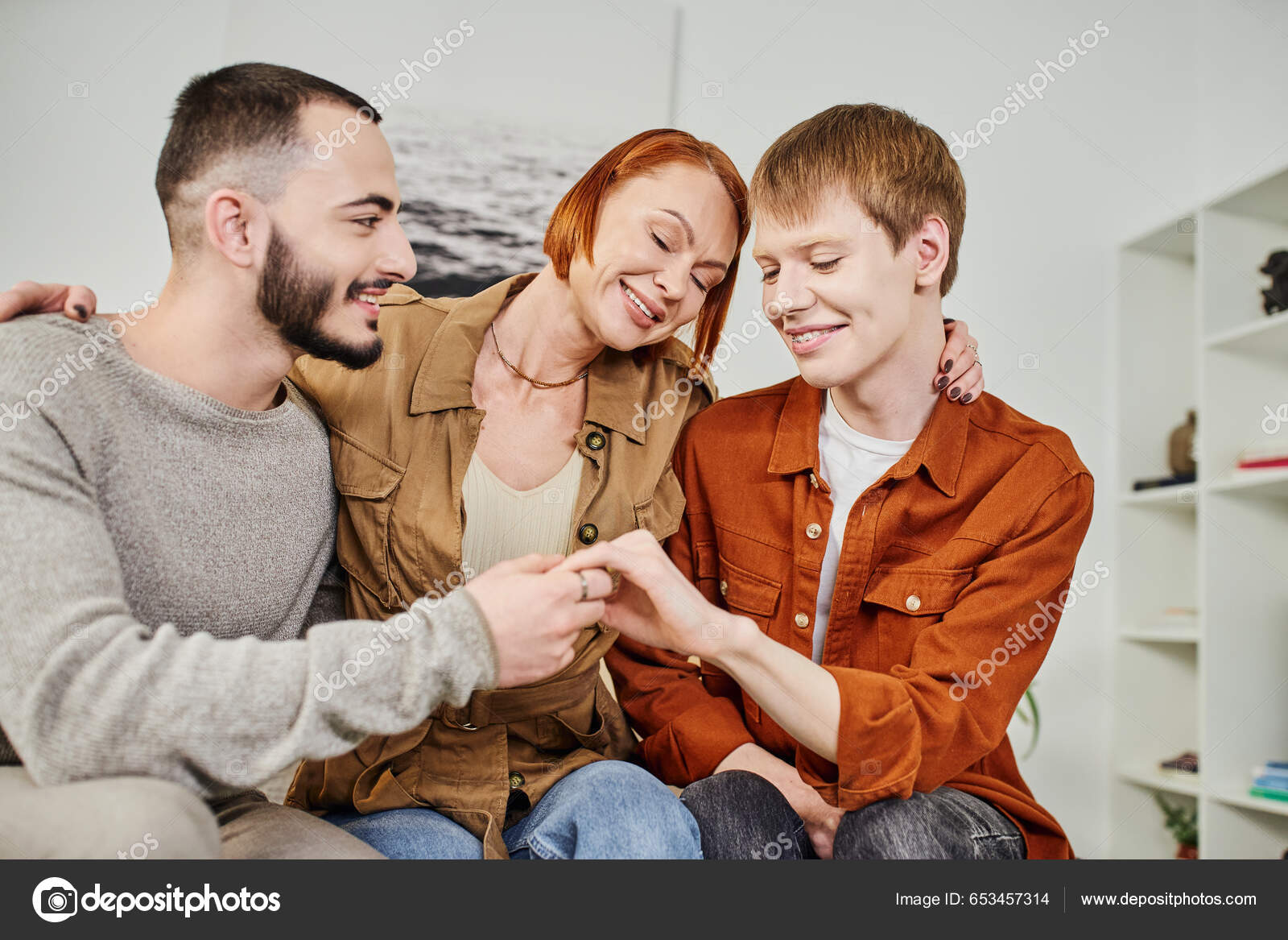 Overjoyed Woman Closed Eyes Embracing Son Gay Partner Home Stock Photo by ©AllaSerebrina 653457314