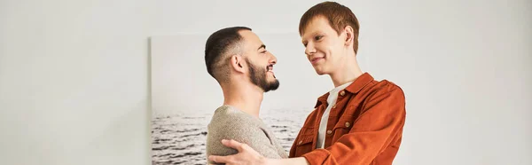 Pleased Gay Men Looking Each While Embracing Bedroom Banner — Stock Photo, Image