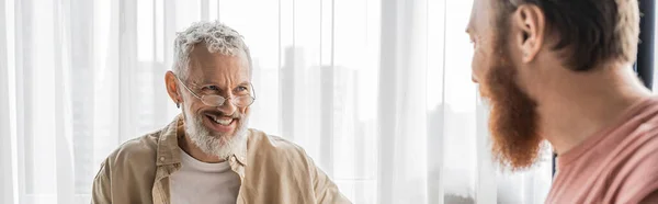 Senior Gay Man Smiling Blurred Partner Home Banner — Stock Photo, Image