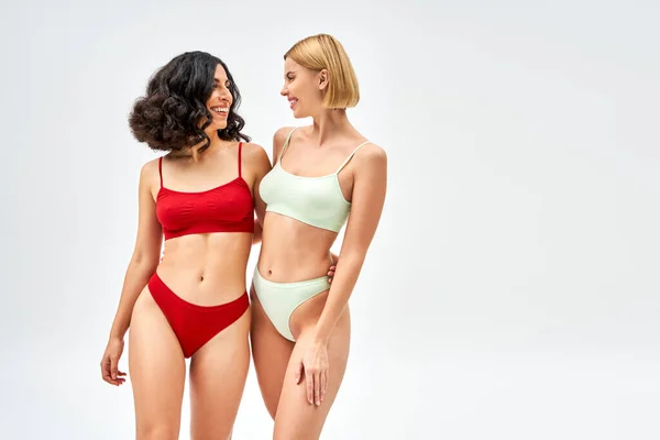 Positive Multiracial Woman Trendy Lingerie Hugging Young Blonde Friend While — Stock Photo, Image