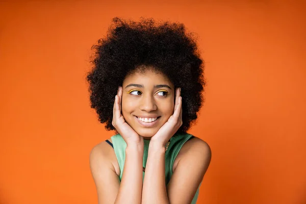 Pleased Stylish African American Teenager Colorful Makeup Touching Face Looking — Stock Photo, Image