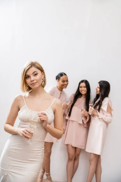 Beautiful Bride Wedding Dress Holding Glass Champagne Standing Blurred Interracial — Stock Photo, Image