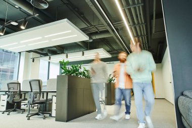 team of energetic entrepreneurs walking along contemporary coworking space with high tech interior, office furniture and green natural plants, movement, long exposure, dynamic business clipart