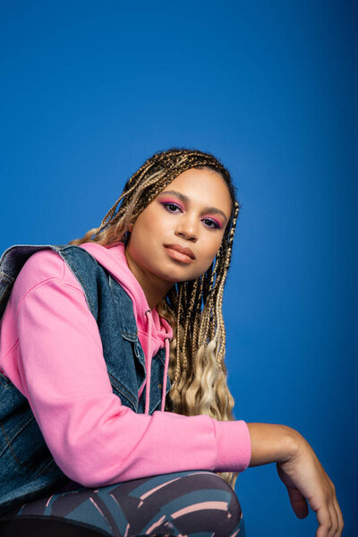 attractive african american woman with dreadlocks looking at camera, portrait, bold makeup