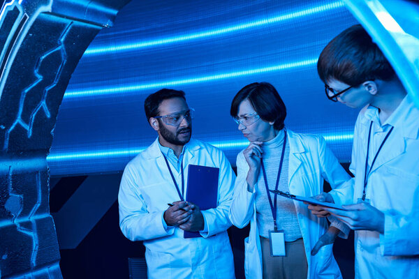 futuristic technologies, discussion of multiethnic scientists in experimental device, science center