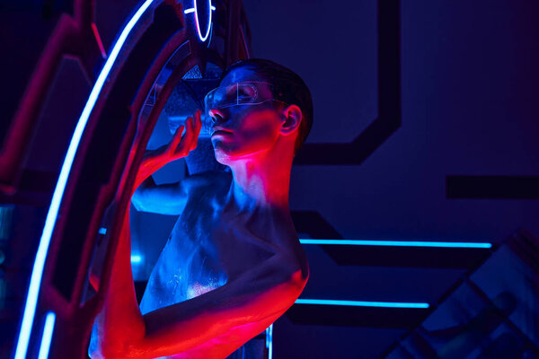 scientific breakthrough, alien in goggles appearing from high-tech equipment in science center