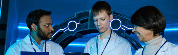 banner, Exploring Tomorrow, Two scientists and an intern collaborate at a futuristic research center