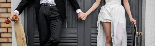 Cropped View Groom Longboard Holding Hands African American Bride Building — Stock Photo, Image