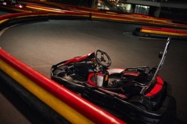go kart, car for racing or red racing, inside of indoor kart circuit, motor race vehicle clipart
