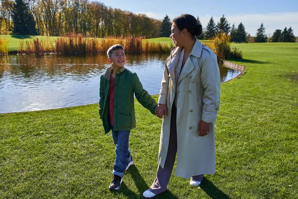 Bonding Happy Mother Son Holding Hands Walking Lake Park African — Stock Photo, Image