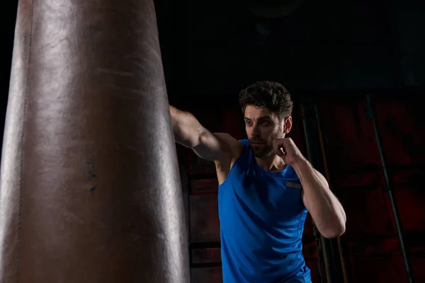 Vigorous Man Blue Tank Top Boxing Punching Bag While Training — Stock Photo, Image