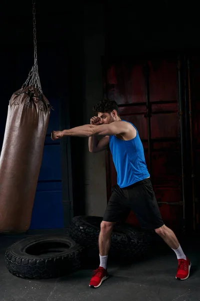 Full Length Man Sportswear Working Out Punching Bag Tires Street — Stock Photo, Image