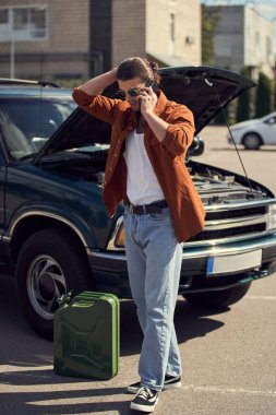 handsome man with sunglasses and ponytail talking by phone with his insurer, petrol canister clipart
