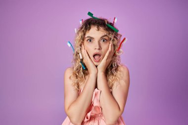 shocked woman in pink dress and toothbrushes in her hair raised hands to cheeks, tooth fairy concept clipart