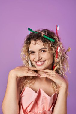 joyful woman in pink dress and toothbrushes in her hair, hands under her chin, tooth fairy concept clipart