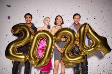multiethnic friends holding balloons with 2024 numbers near falling confetti, New Year party fun clipart