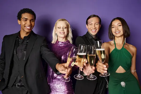 Christmas party, group of cheerful interracial friends in festive attire clinking champagne glasses