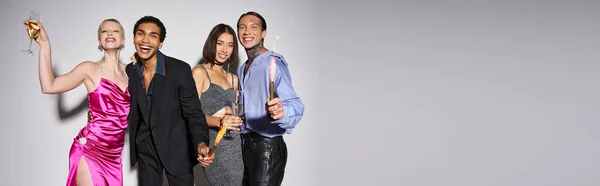 stock image group of happy interracial friends holding champagne and sparkles, celebrating New year banner