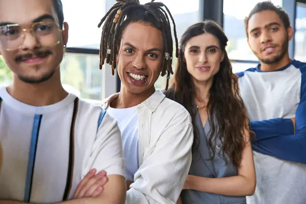 portrait of smiling african american team lead near multicultural colleagues in office, teamwork