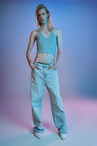 vertical shot of red haired androgynous model in black stylish turtleneck looking at camera