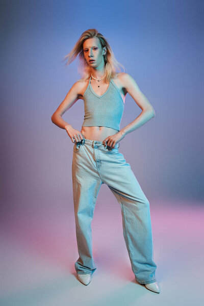 vertical shot of red haired androgynous model in black stylish turtleneck looking at camera