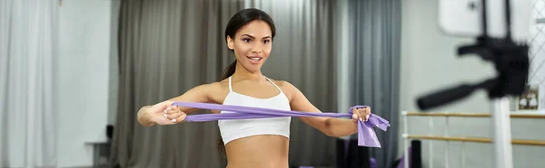 stock image graceful african american dancer in black crop sweater rehearsing in dance hall, horizontal banner