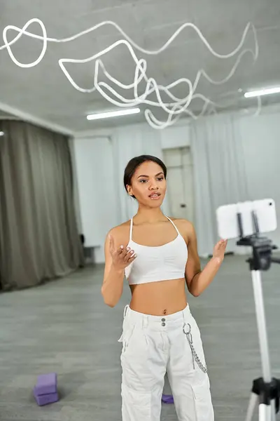 stock image graceful african american dancer in black crop sweater rehearsing in dance hall, horizontal banner