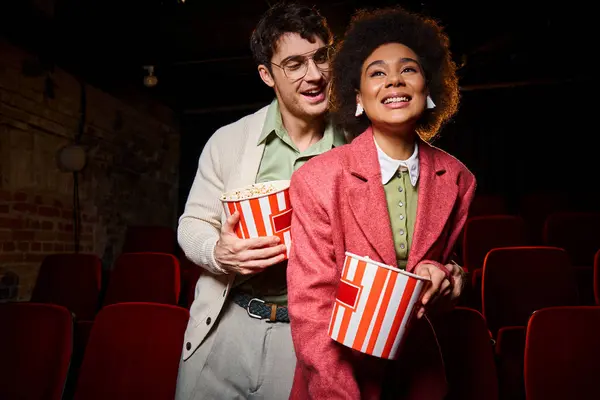 stock image handsome man with glasses looking lovingly at his african american joyful girlfriend on date