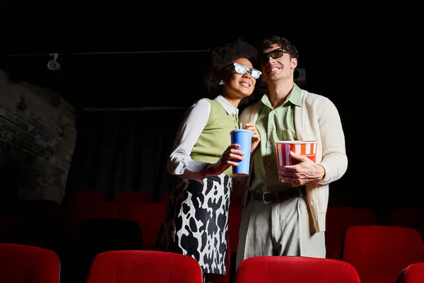 stock image happy diverse couple with 3d glasses with soda and popcorn in hands looking away, Valentines day