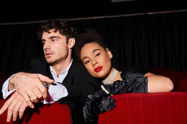 stock image alluring african american woman with looking at camera near her boyfriend on date, Valentines day