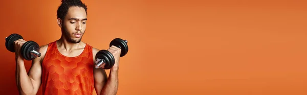 stock image jolly athletic african american man in sportwear with arms akimbo smiling joyfully at camera, banner