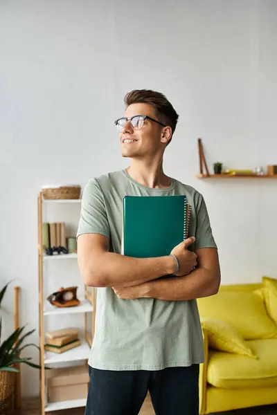 stock image attractive student with vision glasses in living room holding notes with hands and looking to window