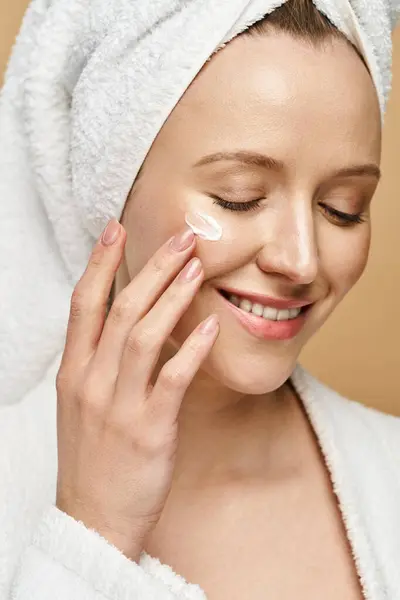 stock image A gorgeous woman exudes natural beauty as she smiles with a towel wrapped around her head.