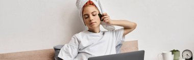 merry pretty queer person with hair towel watching movies on laptop and using gua sha in bed, banner clipart