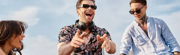 stock image jolly attractive people in casual attires with sunglasses partying at rooftop to DJ set, banner