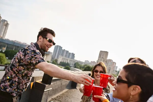 Young Cheerful Diverse Friends Clinking Red Cups Next Equipment Rooftop — Stock Photo, Image