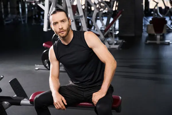 Focused Man Athletic Wear Sits Gym Bench Deep Thought Intense — Stock Photo, Image