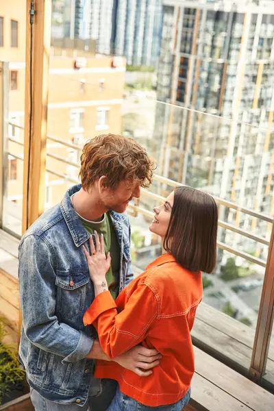 A man and a woman standing side by side, exuding warmth and unity in their body language