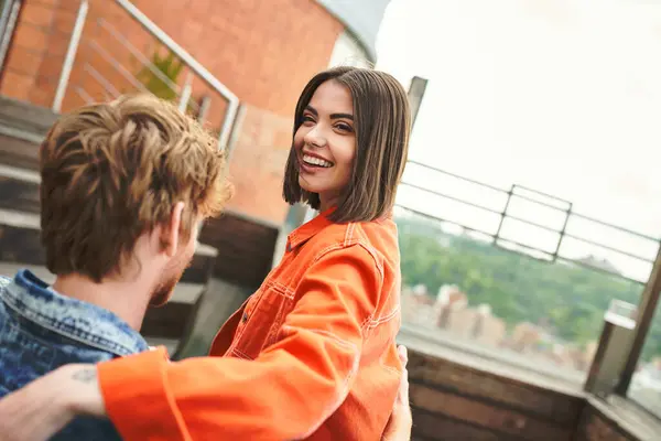 stock image A man and a woman stand together, exuding a sense of companionship and togetherness in their posture and expressions