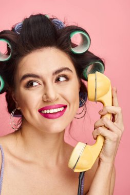 Woman gracefully holding retro phone. clipart