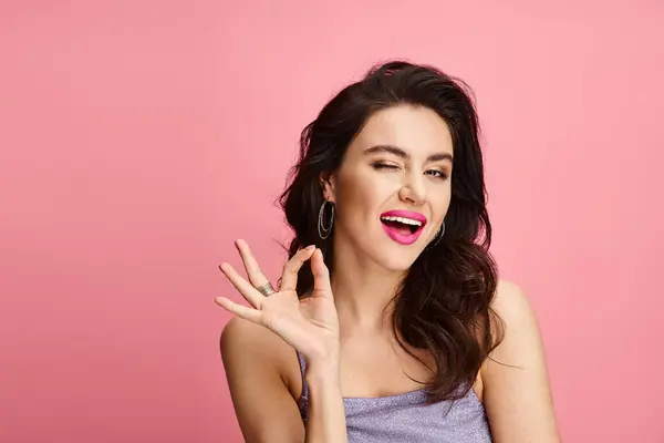 Woman Long Dark Hair Pink Lipstick Poses Vibrant Backdrop — Stock Photo, Image