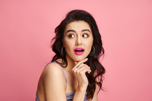 A beautiful woman displays a surprised expression.