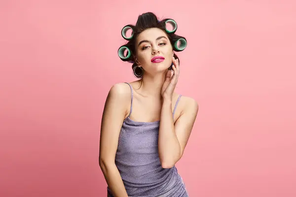 stock image Stylish woman with curlers looking at camera.