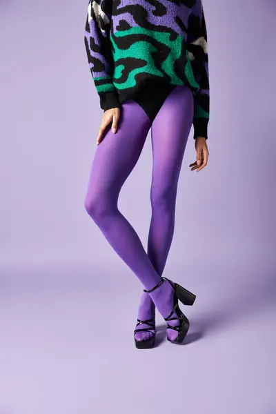 Young Woman Clad Vibrant Purple Tights Sweater Striking Pose Studio — Stock Photo, Image