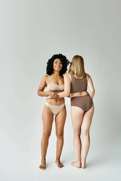 Two Beautiful Diverse Women Cozy Pastel Underwear Stand Next Each — Stock Photo, Image