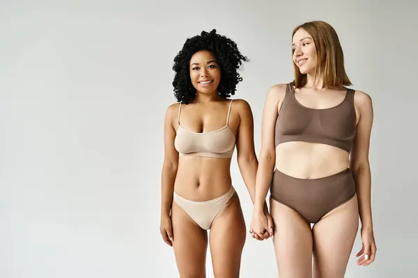 Two Beautiful Diverse Women Cozy Pastel Bikinis Standing Together —  Fotos de Stock
