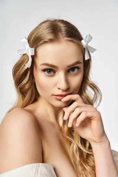 Young Blonde Woman Long Hair Adorned White Bow Studio Setting — Stock Photo, Image