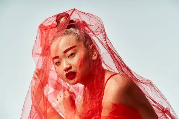 Attractive Asian Woman Red Dress Strikes Dynamic Pose Veil Her — Stok fotoğraf
