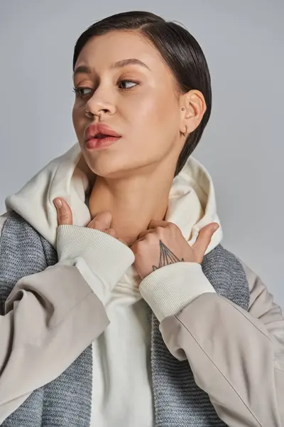 Young Woman Exudes Elegance Gray Jacket White Shirt Neutral Studio — стоковое фото
